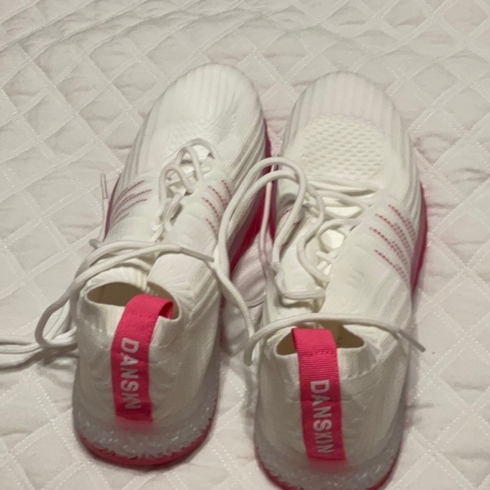 A pair of DANSKIN sneakers